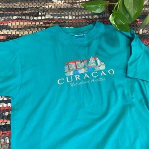 Cool and colorful teal embroidered Curacao tee from the 00s!
